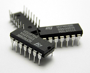 Photo of three integrated circuit chips.